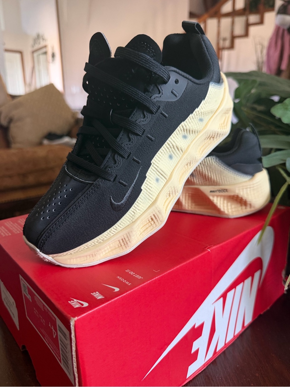 Nike Kids Black Upper with Cream Yellow Accent Sneakers